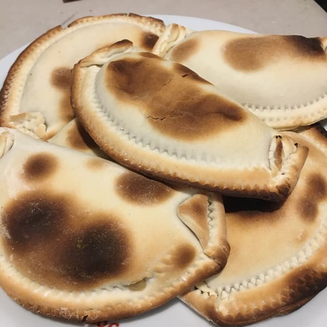 Foto do prato “Empanada De Paparella Y Cebolla”