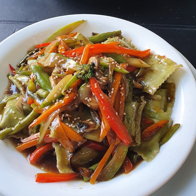 Photo of the dish “ravioles de lentejas con salsa de vegetales salteados”