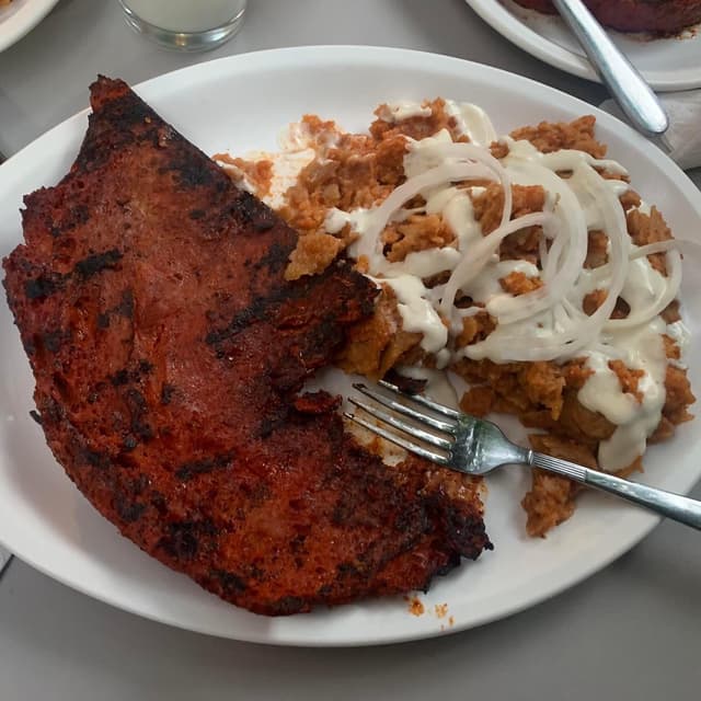 Foto del piatto “Chilaquiles con Seitán enchila”