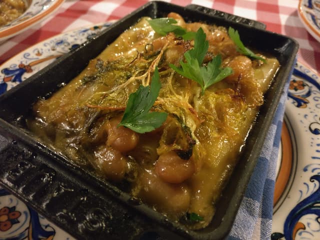 Foto do prato “Sweet Potato and Mushroom Cannelloni, braised escarole and butter beans”