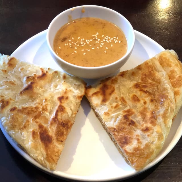 Photo of the dish “Roti & Peanut Sauce, Drumsticks, Duck (from Specials Section)”