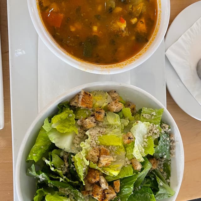 Photo of the dish “Soup Of The Day And Cesar Salad”