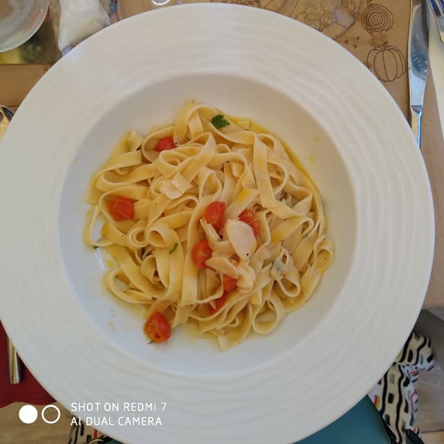 Foto do prato “Tagiatelle Con Ajo Y Cherry”