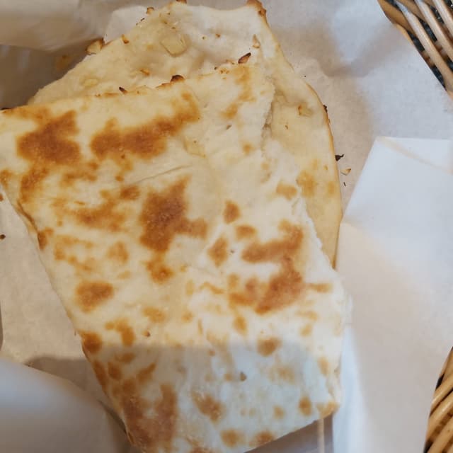 Foto do prato “Garlic Naan”
