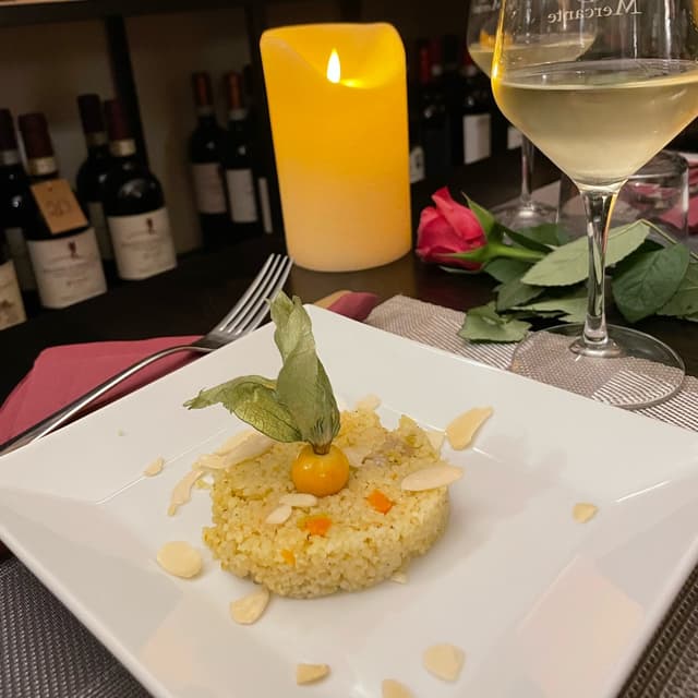 Foto do prato “Cous Cous Con Scorze d’arancia e Mandorle Tostate”
