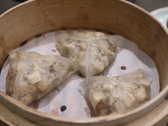 Photo of the dish “Wild Mushroom Dumpling with Black Truffle Sauce”