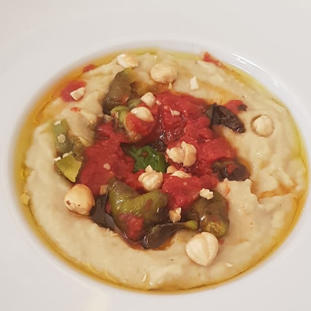 Photo of the dish “Macco di fave pugliese con friarielli al pomodoro e nocciole tostate”