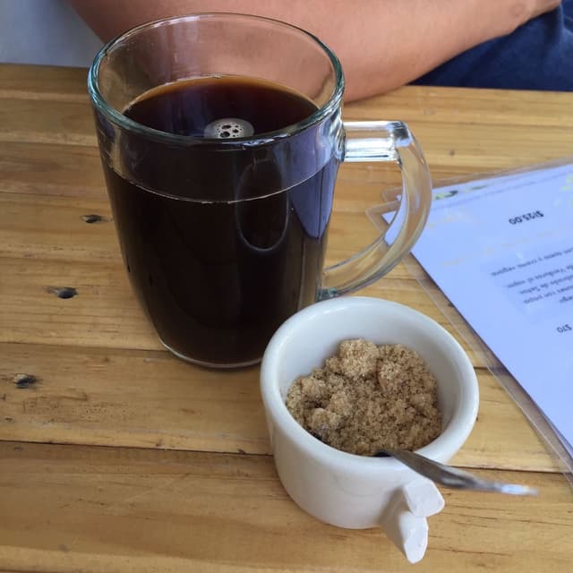 Photo of the dish “Café americano con azúcar mascabado”
