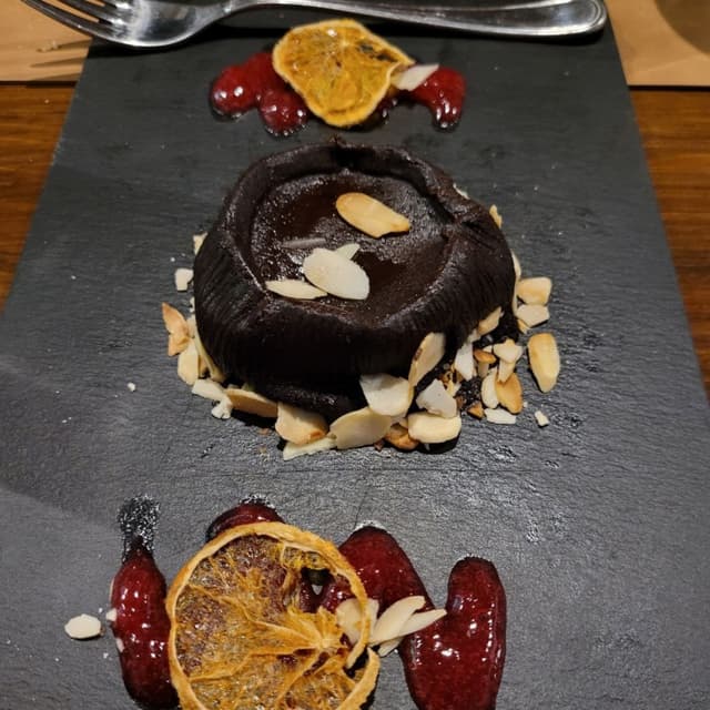 Photo of the dish “Bottone Alle Mandorle E Cioccolato”