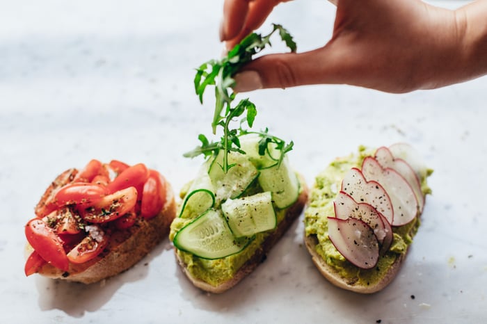 three slices of bread with veggie toppings