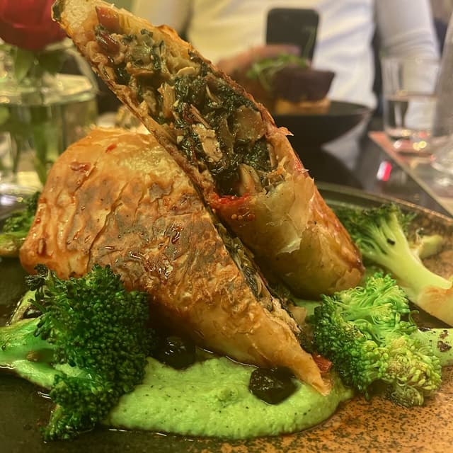 Photo of the dish “Chard and Flaked Almond, Lemon 'Feta', with seared Broccoli, green Pea-Mint Mousse, fermented Blueberries”