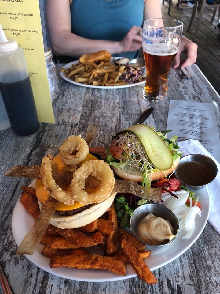 photo of Fish on Fifth The Beyond beef burger with, vegan cheese, bacon bun and mayo.  This restaurant has over 25 vegan options on their menu!  Two thumbs up! shared by @taylorwinfrey on  15 Jul 2018 - review