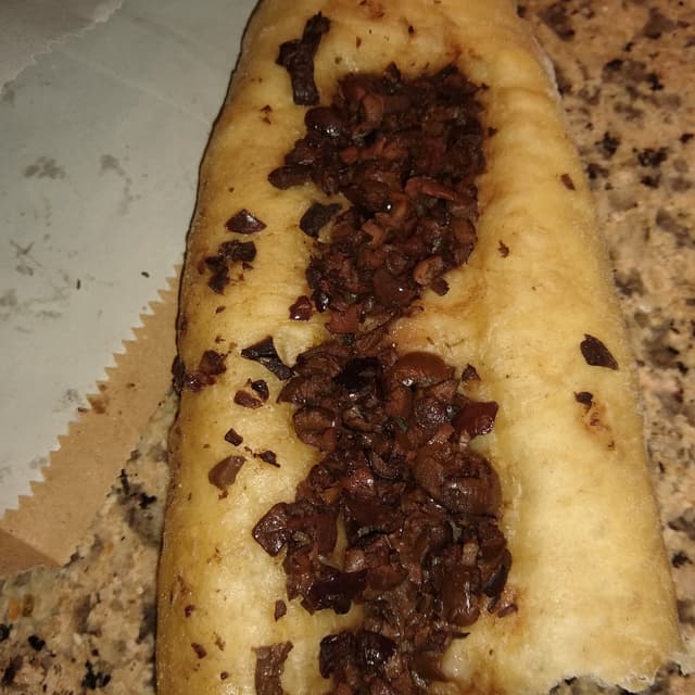 菜肴“focaccia con olivas”的照片