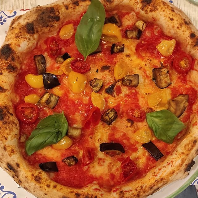 Photo of the dish “Pizza con melanzane e pomodorini”