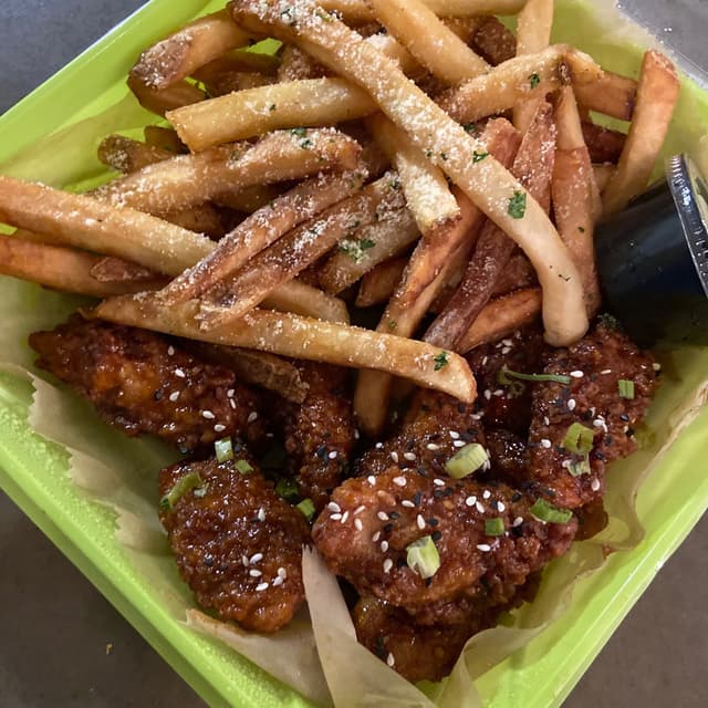 Photo of the dish “The “Bird’s Nest” Boneless Chick’n Wings And Vegan Parmesan Truffle Fries”