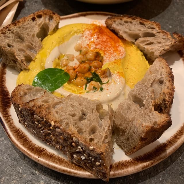 Foto do prato “Hummus Del Día”