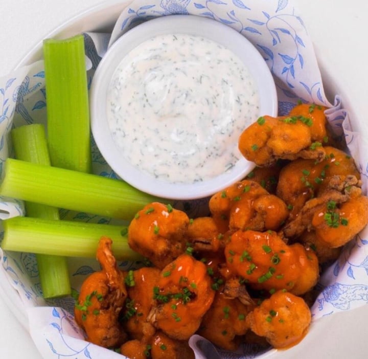 review photo of Earls Kitchen + Bar Vegan Buffalo Cauliflower Wings shared by @kendallstephan on 16 Jul 2019 - review