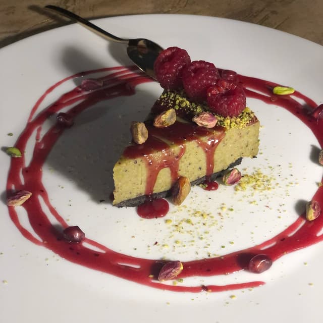 Foto del plato “Cheese cake al pistacchio e lamponi”