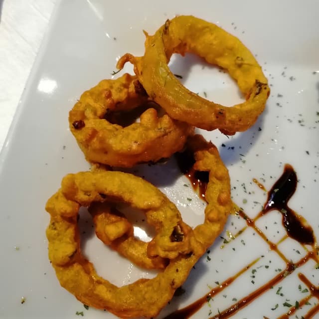 Foto do prato “Onion rings”