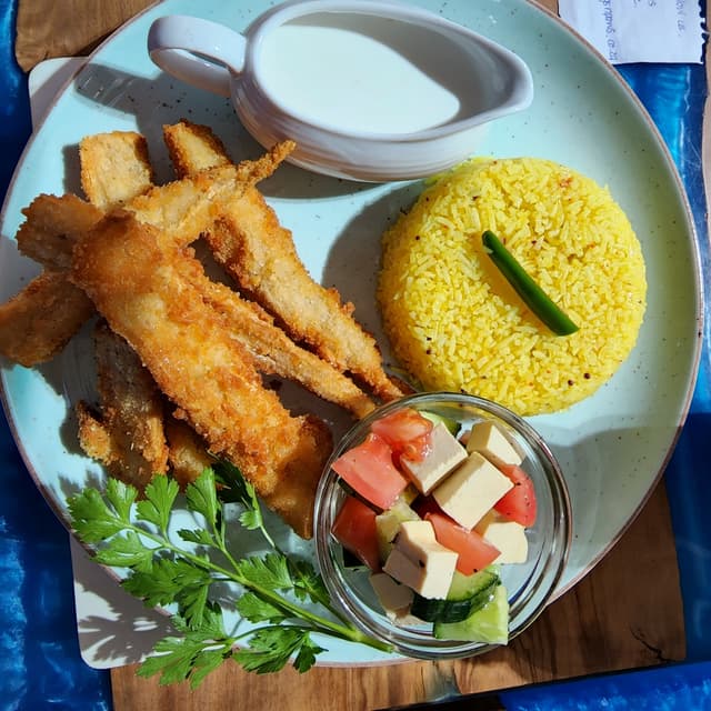 Photo of the dish “Vegan Calamari Served With Fries, Salad And Vegan Lemon Mayo Sauce”