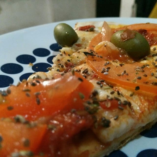 Foto do prato “Pizza napolitana y fugazzeta”