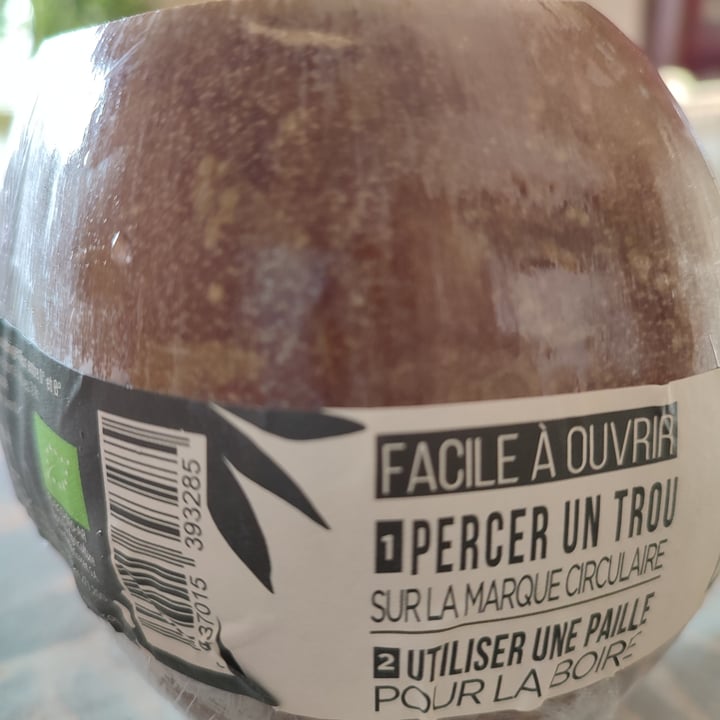 photo of Genuine Coconut Fresh Organic Coconut with a straw and a bamboo stick shared by @frenchvegangirl on  14 Mar 2022 - review