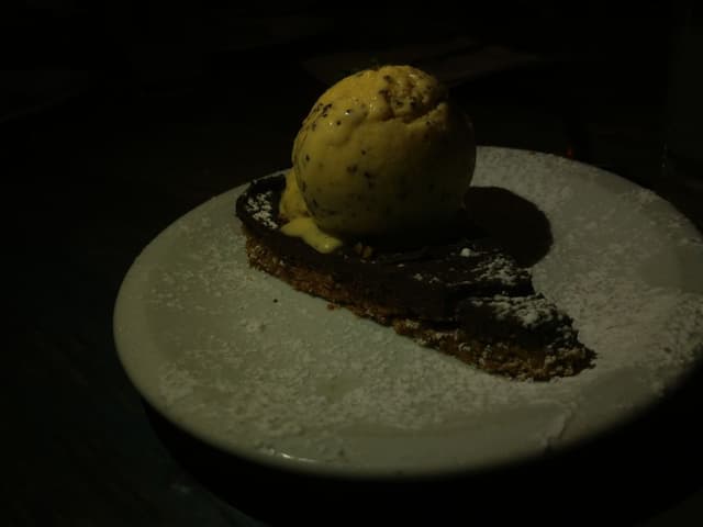 Photo of the dish “Chocolate mousse cake with coconut ice cream”