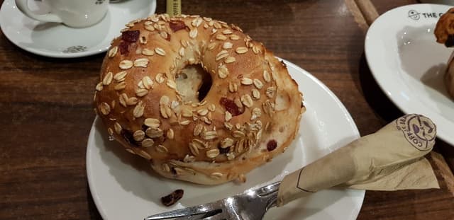 Photo of the dish “Cranberry Oatmeal Begal.”
