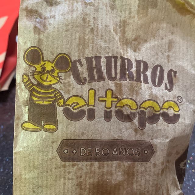 Foto do prato “Churro relleno de manteca de mani”