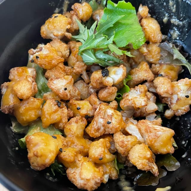 Foto do prato “Po-po-popitas/Palomitas de coliflor”