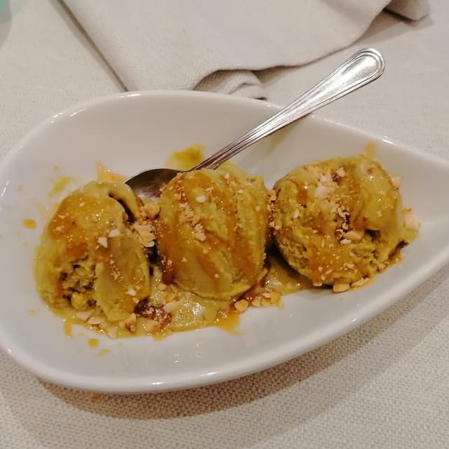 Photo of the dish “Gelato al pistacchio salato, granella di nocciole e caramello”