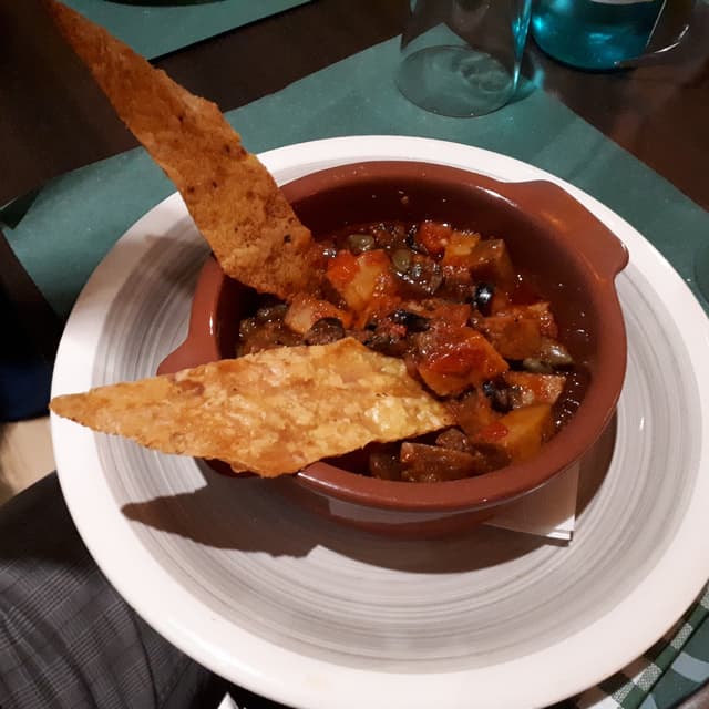 Photo of the dish “Seitan alla pizzaiola con crackera di ceci”