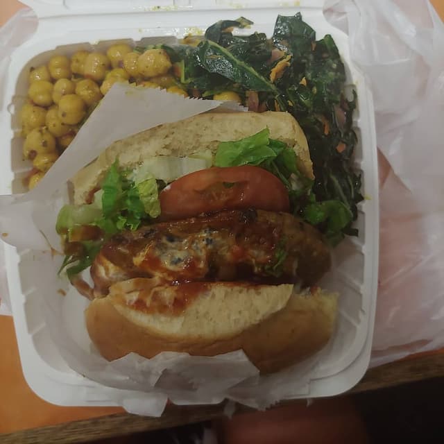Photo of the dish “Black Bean Burger, Ginger Collard, and Carribean Chickpea Salad”