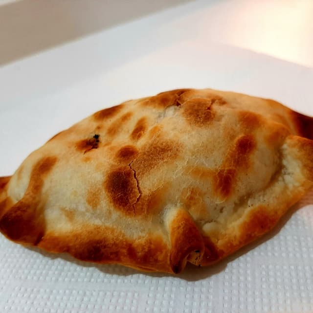 Foto del plato “Empanada de humita”