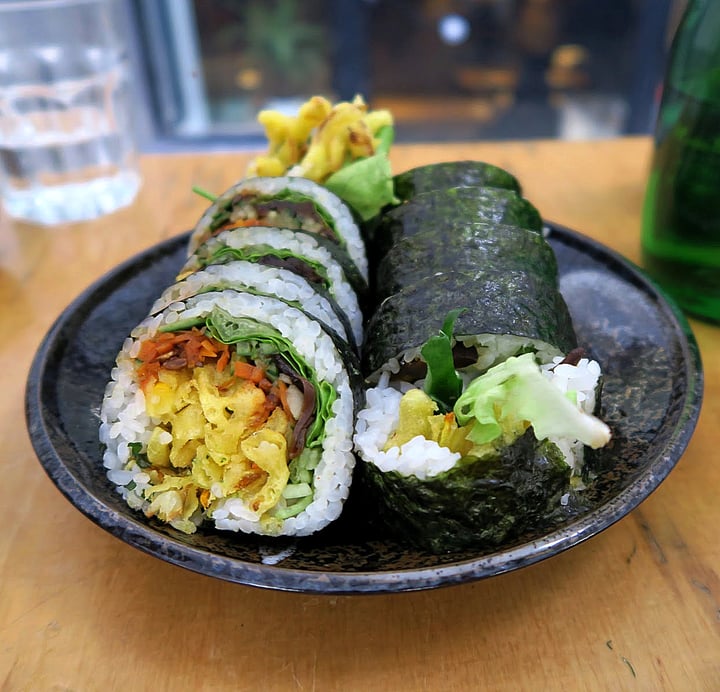 photo of Youmiko Vegan Sushi Okimari IV: 2 nigiri / temari, 2 gunkan maki, 2 cake, 6 hosomaki, 8 uramaki wrapped and 10 futomaki shared by @travellingweasels on  01 May 2021 - review