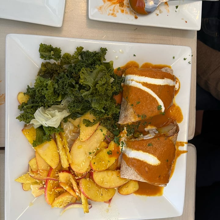 photo of Garden Cafe Woodstock indian red lentil vegetable enchilada with coconut tomato sauce, sour cream, curry coconut apple salad and sauteed greens shared by @manjugarg on  20 Oct 2022 - review
