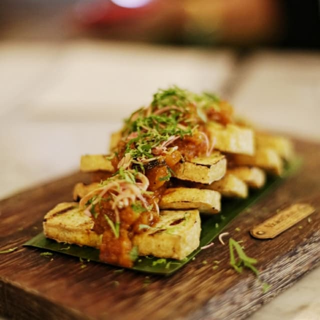 Photo of the dish “Garam Assam Tau Kwa with Pineapple and Pink Flower Ginger”