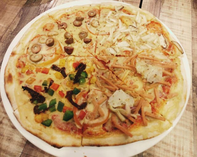 Photo of the dish “Four Seasons Pizza”