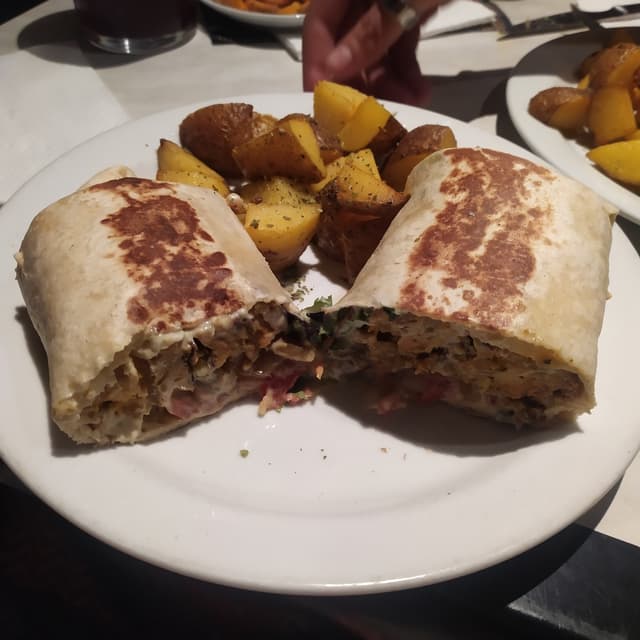 Foto do prato “wrap de pollo vegano”