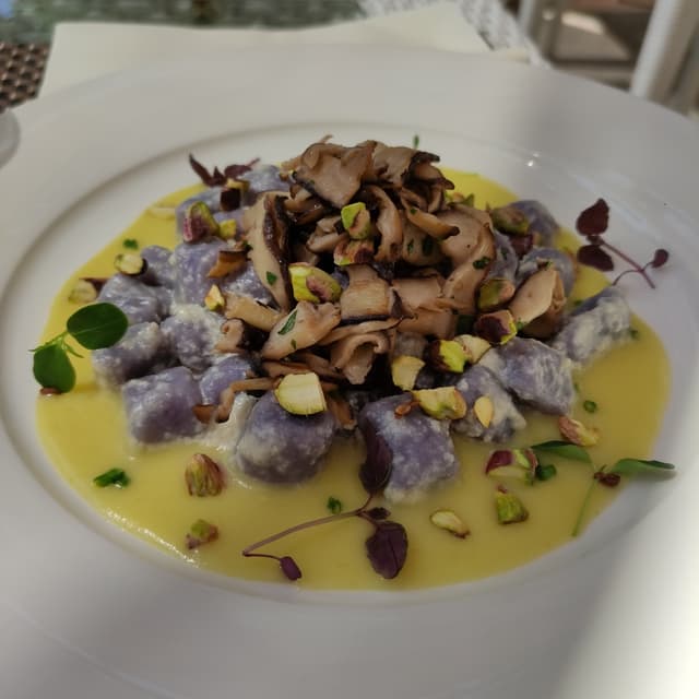 Photo of the dish “Gnocchetti di patate viola con Funghi E Pistacchi”