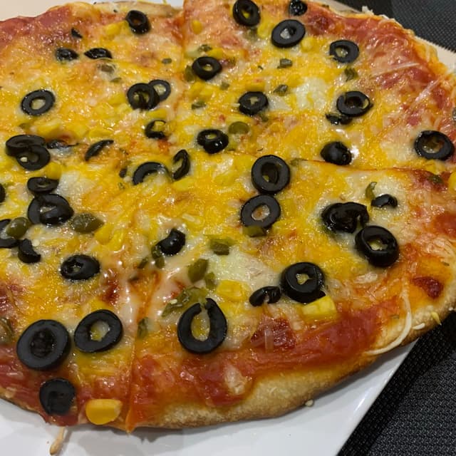 「Pizza Picante Con Jalapeños」の料理の写真
