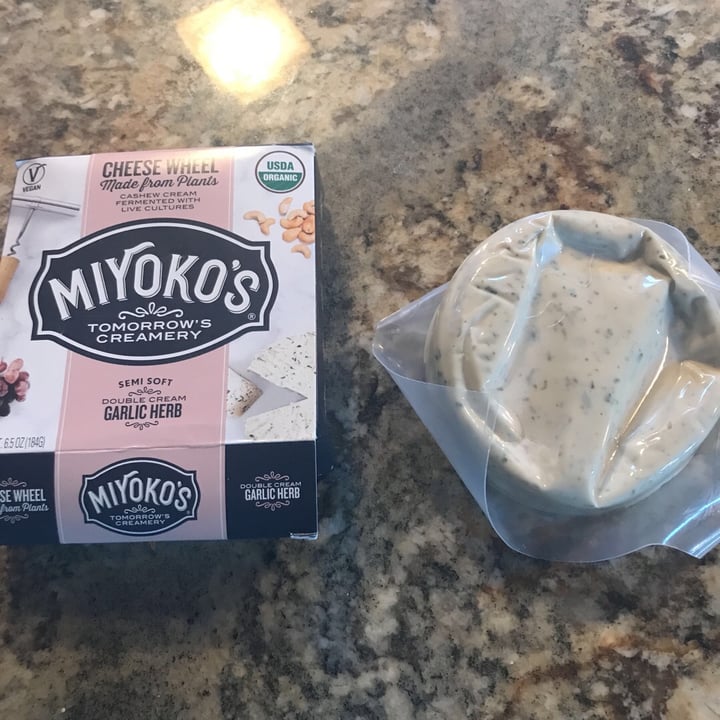 photo of Miyoko's Creamery Semi Soft Double Cream Garlic Herb Cheese Wheel shared by @rikihiggins on  24 May 2019 - review