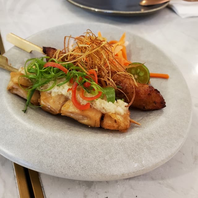 Photo of the dish “Signature Skewers (Ginger & Scallion Heura Chicken, Thai OmniFish Cake)”