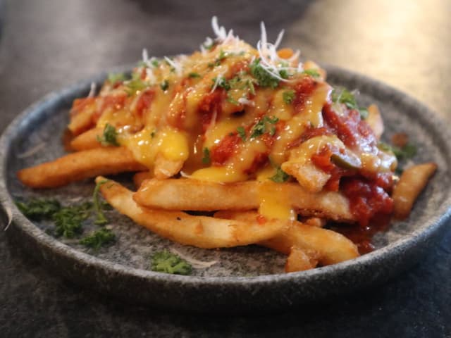 Photo of the dish “French Fries, Chili Bolognaise, Daiya Cheese”