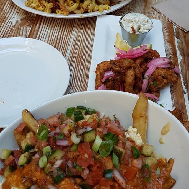Photo of the dish “Butter Chikkin Poutine”