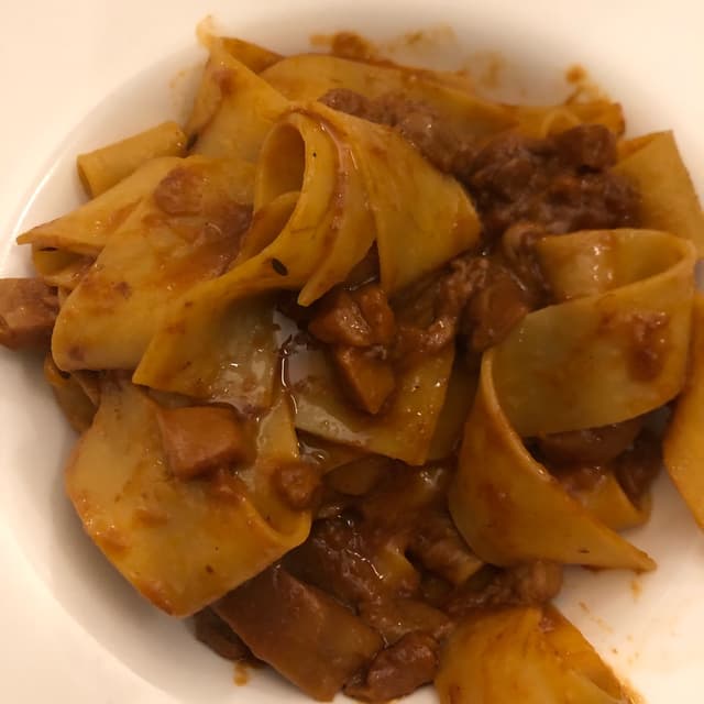 Foto do prato “Tagliatelle con ragù di funghi”