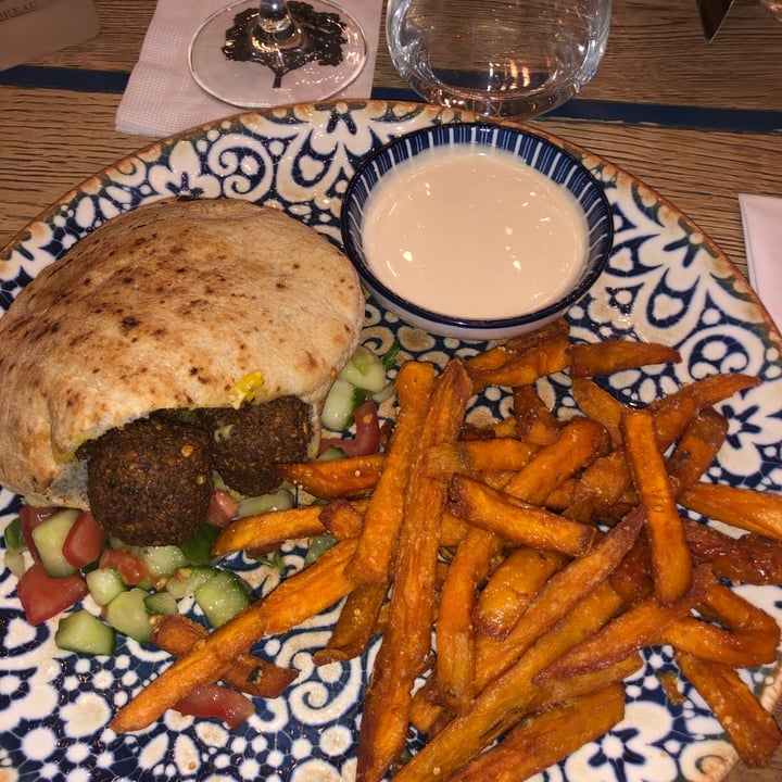 photo of Mazel Tov Fresh grilled pita stuffed with hummus, Israeli salad and crispy falafel. The plate comes with homemade potato chips and tahini. shared by @giadapirozzini on  01 Dec 2021 - review