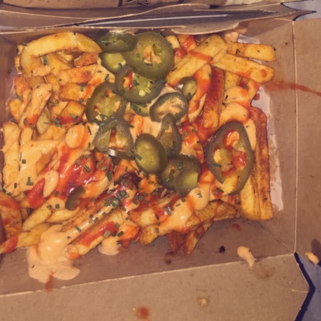 Photo of the dish “Buffalo Chikn fries, BBQ Chikn burrito, cheesy fries”