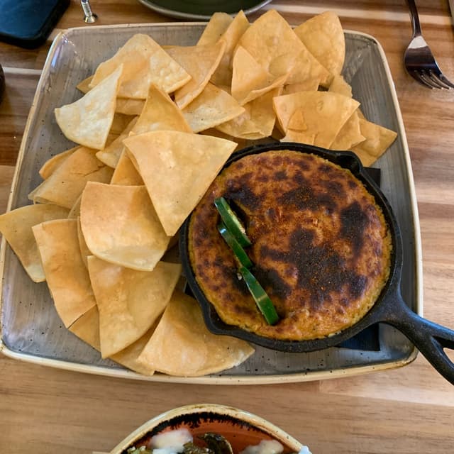 「Chips With Cashew Cheese Dip, and Brussel Sprouts」の料理の写真