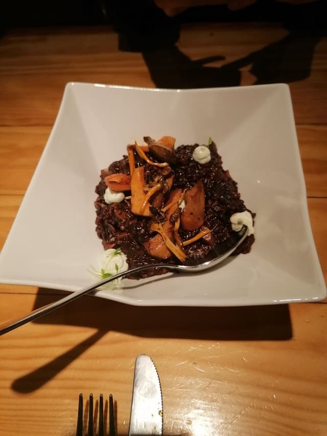 Photo of the dish “Arroz negro mar y montaña”